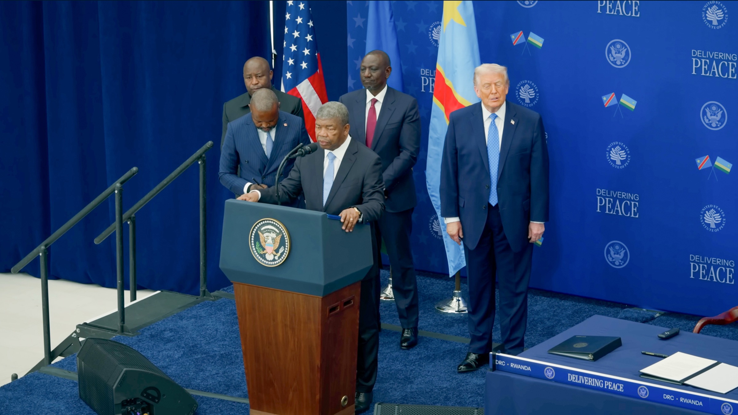 President João Lourenço speaking at the podium at the signing of the peace agreement between the Democratic Republic of the Congo and Rwanda, Washington, D.C.